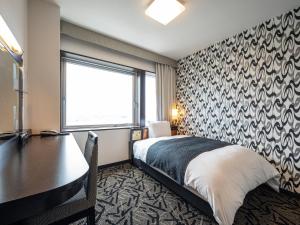 Gulta vai gultas numurā naktsmītnē APA Hotel Shonan Tsujido Ekimae