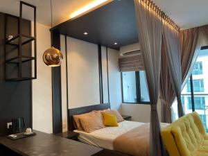 a bedroom with a bed and a desk and a window at Le Cozy Home UKM BANGI KAJANG BACC GMI UIS in Bangi +20 photos