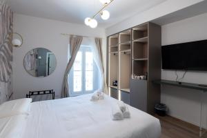 TV a/nebo společenská místnost v ubytování Maison Rasella Palace Suites