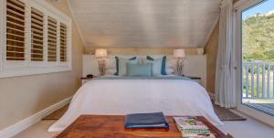 Postel nebo postele na pokoji v ubytování Amanzi Island Boutique Hotel