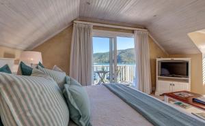 TV a/nebo společenská místnost v ubytování Amanzi Island Boutique Hotel