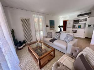 a living room with a couch and a coffee table at ARTs at the Old Town in Grottammare