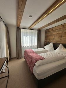 Postel nebo postele na pokoji v ubytování Klamm Lodge