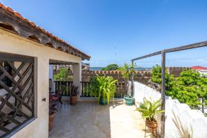 a view from the balcony of a house with plants at Subira House in Lamu