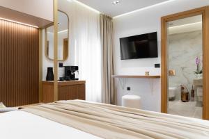 Postel nebo postele na pokoji v ubytování Aeolian Spirit Suites