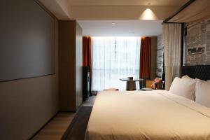 Arthur Hotel Baiyun Guangzhou客房内的一张或多张床位