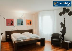 A bed or beds in a room at arte Hotel Linz
