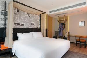 Arthur Hotel Baiyun Guangzhou客房内的一张或多张床位