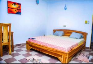 Postel nebo postele na pokoji v ubytování Hôtel RIO Ouidah