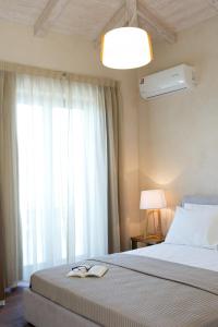 Postel nebo postele na pokoji v ubytování Ionian Horizon Villas