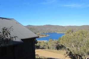 a view of a lake from a house at Chalet Jindabyne in Jindabyne