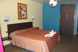 Postel nebo postele na pokoji v ubytování Hotel L'ebene Verte