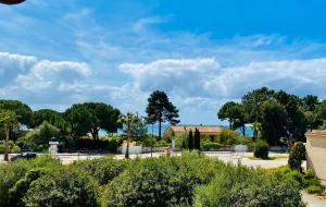 a view of a park with trees and a building at Le Cosy Corse in Vico +6 photos