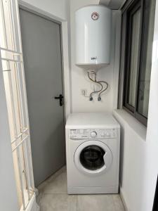 a washer and dryer in a room with a window at Sofia 1 Tanger #Castilla in Tangier