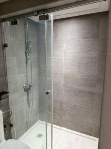 a shower with a glass door in a bathroom at Sofia 1 Tanger #Castilla in Tangier