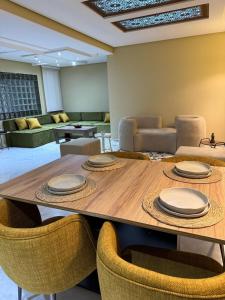 a dining room with a table and chairs at Sofia 1 Tanger #Castilla in Tangier