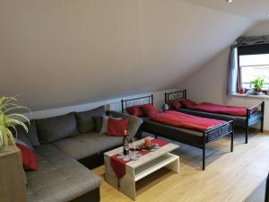 a living room with a couch and a table at Ferienwohnung Schöner in Oberharmersbach