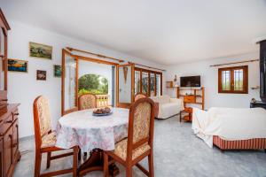 a living room with a table and chairs at Sa Torre Nova Ref 50 in Sant Llorenç des Cardassar