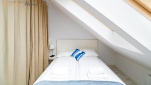 Łóżko lub łóżka w pokoju w obiekcie Wonder Home - Apartament blisko Ski Arena, szlaków turystycznych i Kościółka Wang