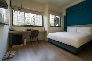 Postel nebo postele na pokoji v ubytování 星輝旅宿 MS Hotel 一中館