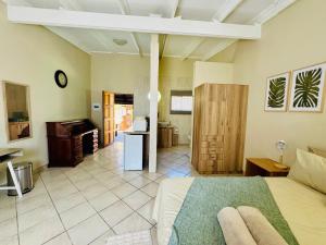 a large room with a bed and a kitchen at The Well, Mokopane in Mokopane
