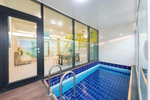 a swimming pool in a house with at Paju Hey-ri Wolabal in Paju