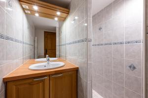 a bathroom with a sink and a shower at Appartement 12 - Les Aravis in Crest-Voland +16 photos