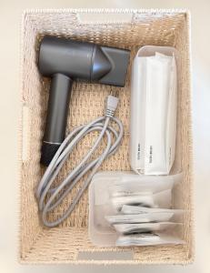a box with a hair dryer and a blow dryer and other items at 錦糸町-601 in Tokyo