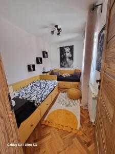 a bedroom with a bed and a desk in it at Indigo Dreams in Ogulin