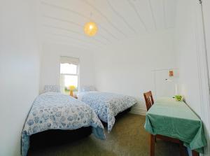 Postel nebo postele na pokoji v ubytování Top Hill House