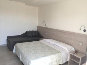 Postel nebo postele na pokoji v ubytování Hotel Astor