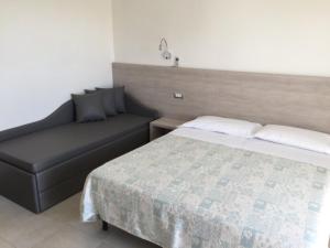 Postel nebo postele na pokoji v ubytování Hotel Astor