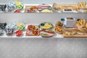 a buffet with many different types of food on display at Villa My Lake in Zamárdi