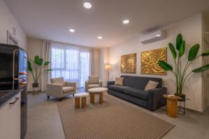 Un televizor și/sau centru de divertisment la Apartamentos San Martín