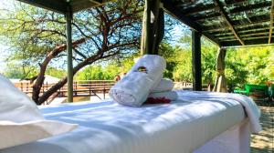 Una cama o camas en una habitación de Samburu Elephant Lodge