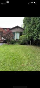 a house with a yard with green grass at 105 Robert Drive in Syracuse