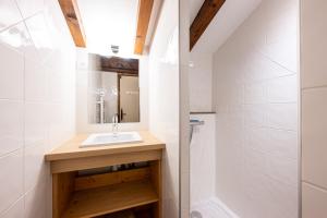 a bathroom with a sink and a shower at Studio 18 - Le Chamois in Crest-Voland +18 photos