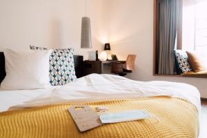 Postel nebo postele na pokoji v ubytování Blue City Boutique Hotel