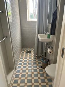 a bathroom with a sink and a toilet at Village house & garden for summer hangout near Sankt Olof in Onslunda