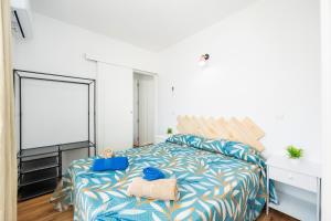 Łóżko lub łóżka w pokoju w obiekcie Gran Sol Family 5