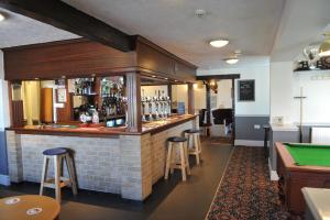 a bar in a pub with a pool table at California Inn in Brynteg