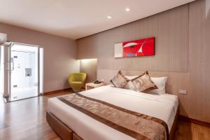 Ένα ή περισσότερα κρεβάτια σε δωμάτιο στο Palette Hi Hotel Bangkok +46 φωτογραφίες