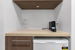 a kitchen with a counter top and a stove at Violet Studio - Seaside Nook with Resort Pools and Spa in Palm Cove