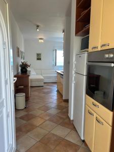 Kuchyň nebo kuchyňský kout v ubytování Beachfront Family Escape, Ciovo