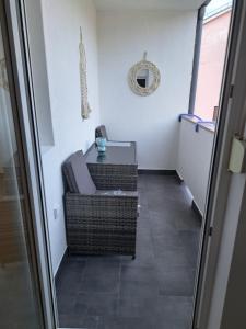 a room with a table and a chair in a room at Apartman Lopar 2,Crikvenica in Crikvenica