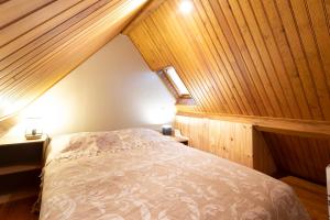 a bedroom with a bed in an attic at Two-Villa Estate with Pool & Valley Views in Salvagnac-Cajarc +31 photos