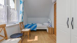 Posteľ alebo postele v izbe v ubytovaní Apartamenty Sun & Snow Rumiankowa