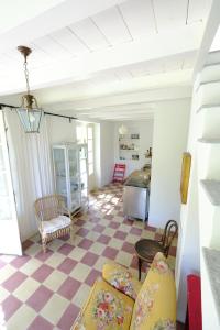 a living room with a checkered floor at Casa Collina by PortofinoVacanze in San Lorenzo della Costa +64 photos