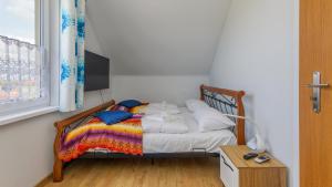 Posteľ alebo postele v izbe v ubytovaní Apartamenty Sun & Snow Rumiankowa