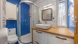 Kúpeľňa v ubytovaní Apartamenty Sun & Snow Rumiankowa